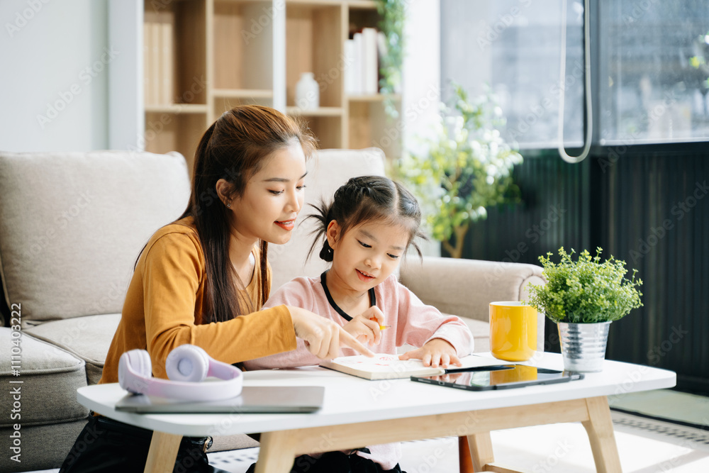 Cheerful mother and daughter sharing quality time on a couch, smiling and using a smartphone together. Cheerful mother and daughter sharing quality time on a couch, smiling and using a smartphone together.