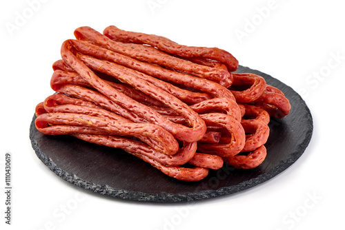 Kabanos thin dry sausage, snacks for beer, isolated on the white background. photo