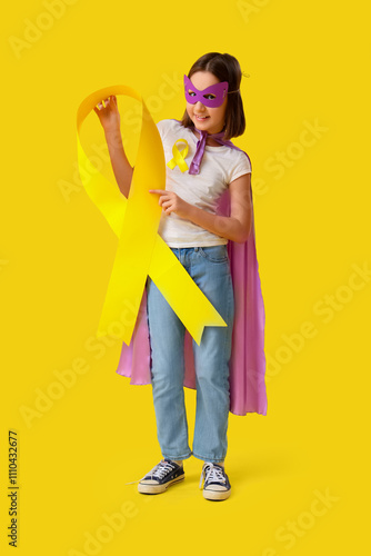 Little girl dressed as supe...