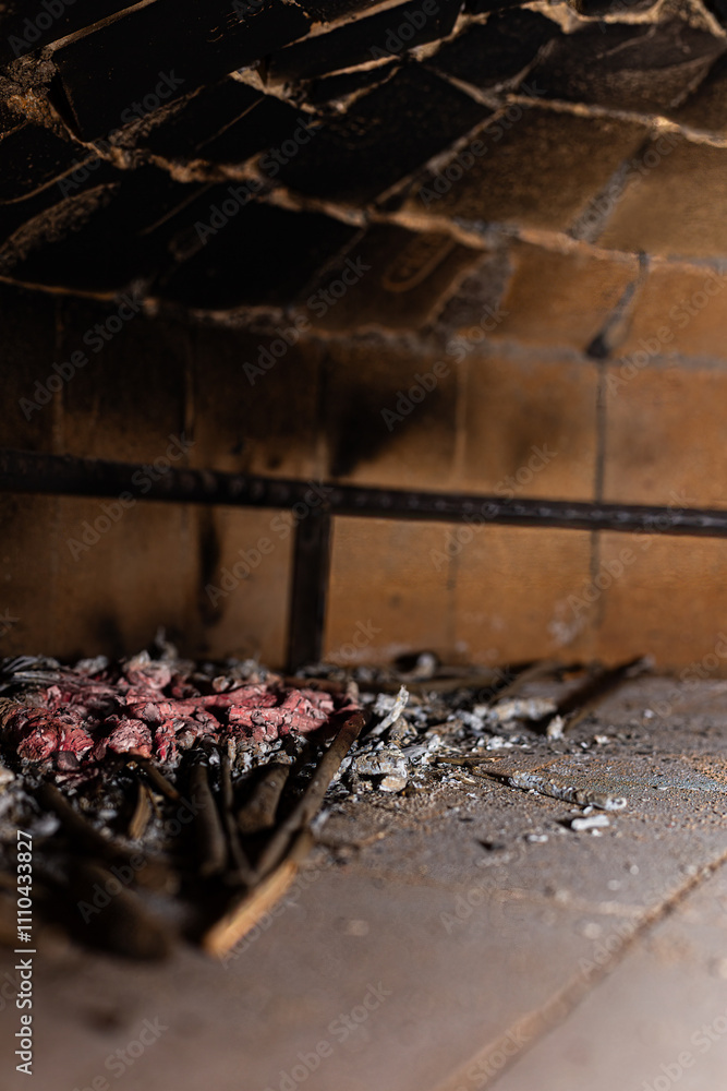 The ancient warmth of the fire fills this wood-fired oven, offering a return to traditional cooking methods and the rediscovery of authentic flavors.