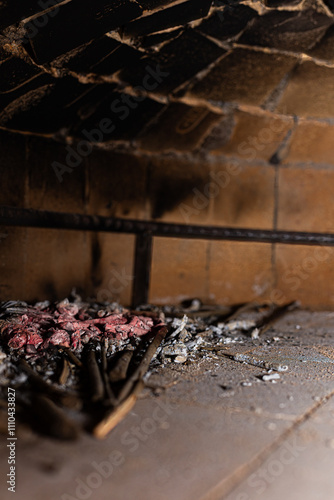 Obraz na płótnie The ancient warmth of the fire fills this wood-fired oven, offering a return to traditional cooking methods and the rediscovery of authentic flavors. w salonie