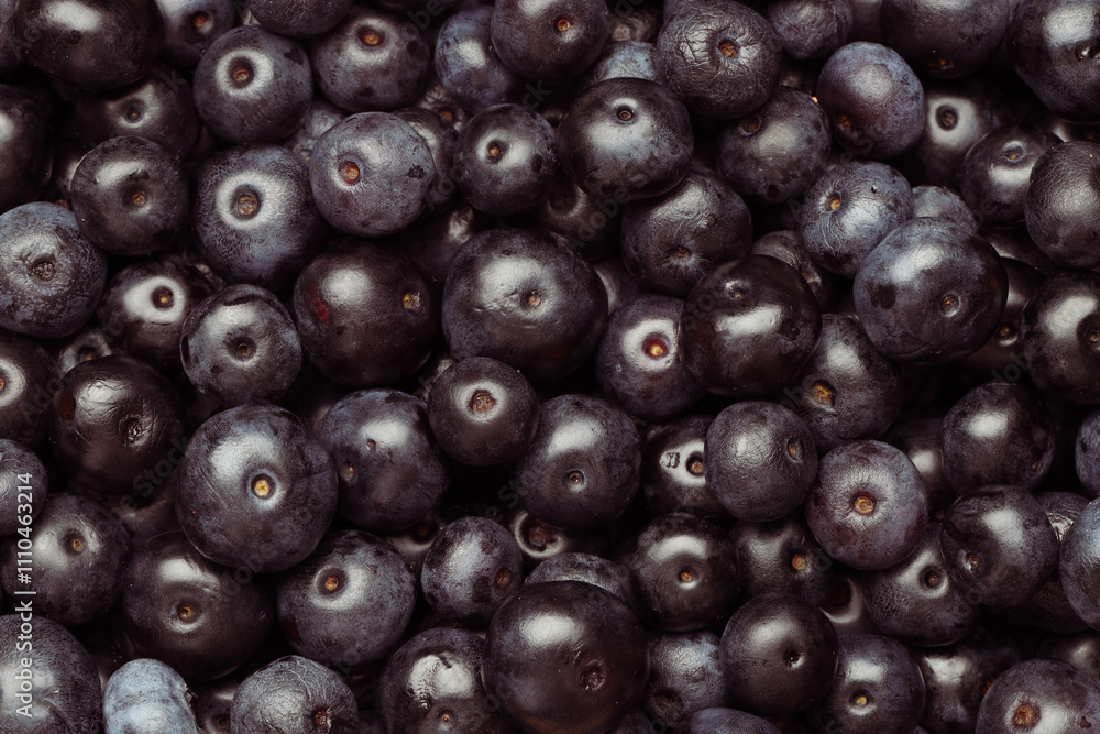 Ripe acai berries as background, top view Ripe acai berries as background, top view