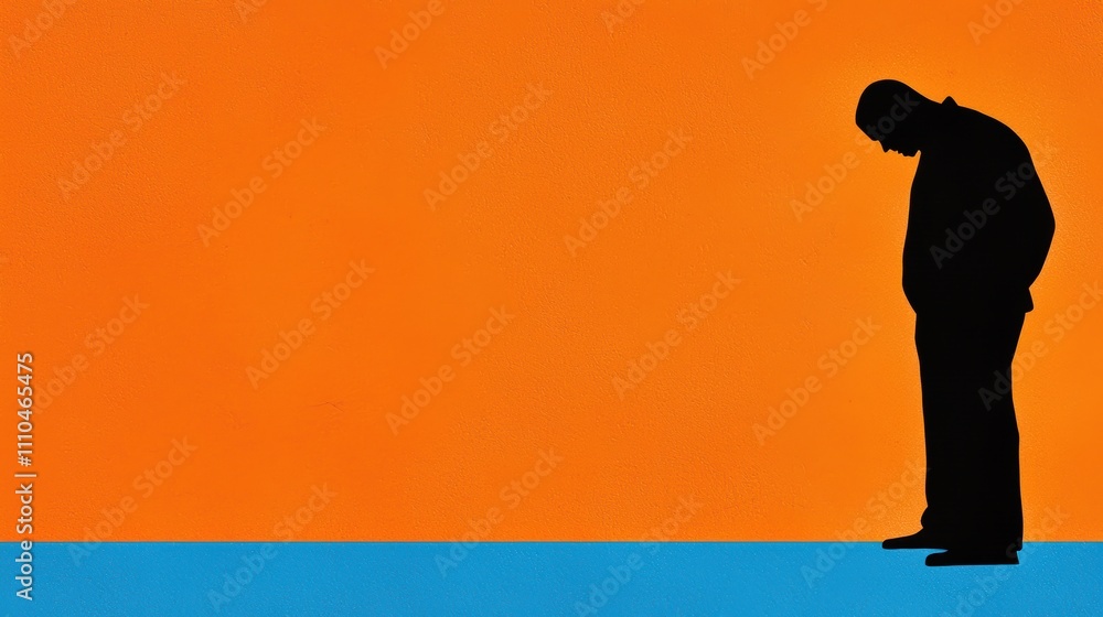 Obraz premium Silhouette of Man in Contemplation Against Vibrant Background