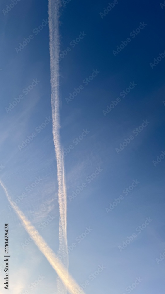 Two Contrails in a Pale Blue Sky Two Contrails in a Pale Blue Sky