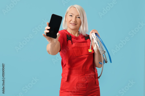 Mature female plumber with ...