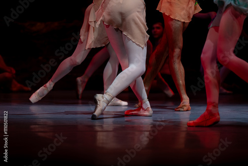 Closeup of ballerinas dancing on stage.