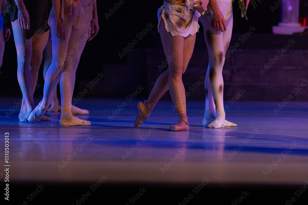 Closeup of ballerinas dancing on stage.