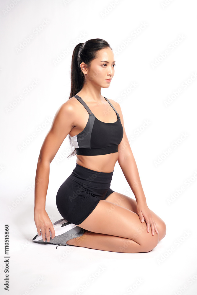 an asian woman is working out wearing the sport exercise suit with white background, an asian woman is working out wearing the sport exercise suit with white background,