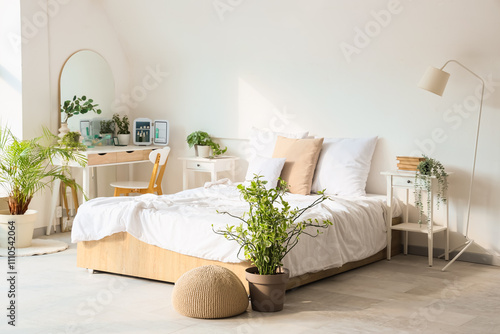 Interior of light bedroom w...