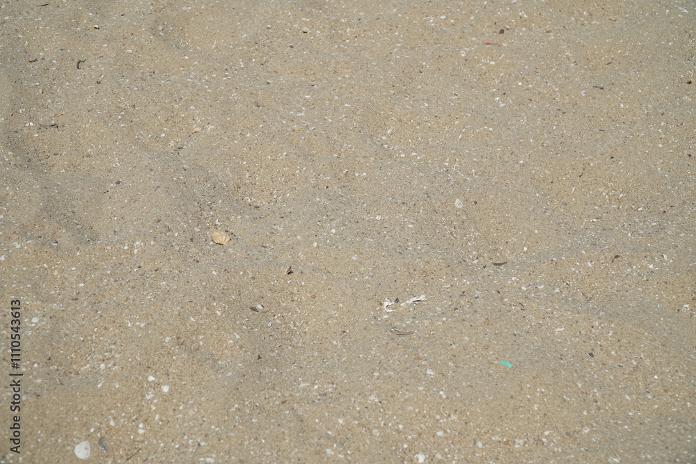 Beige Beach Sand with delicate textures and sun flare on surface, fine sandy beach at sunlight, minimal nature backdrop, calm concept, natural shore ocean or sea close up texture outdoor. Beige Beach Sand with delicate textures and sun flare on surface, fine sandy beach at sunlight, minimal nature backdrop, calm concept, natural shore ocean or sea close up texture outdoor.