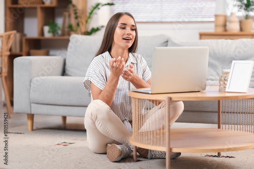 Young woman video chatting ...