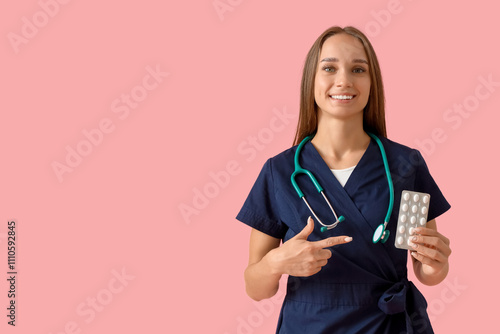 Young female doctor pointin...