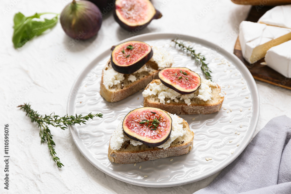 Plate of delicious fig bruschetta with ricotta cheese on white background, closeup Plate of delicious fig bruschetta with ricotta cheese on white background, closeup