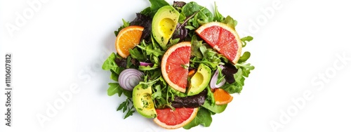 A tangy grapefruit and avocado salad with mixed greens, red onion, and a citrus vinaigrette