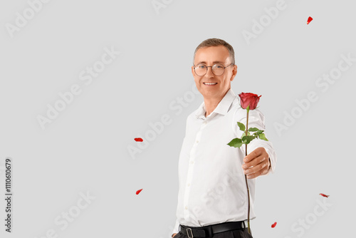 Happy mature man with rose ...