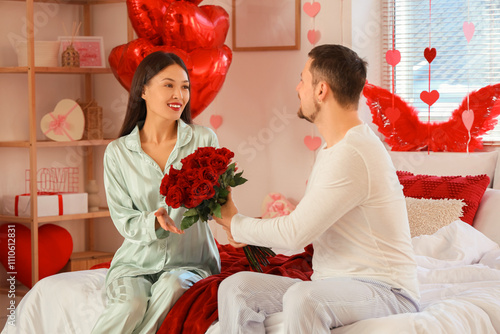 Young Asian woman receiving...