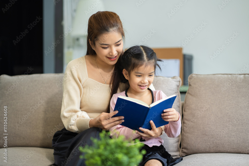 Mother and daughter spend their holiday in the living room at home. Mother and daughter spend their holiday in the living room at home.