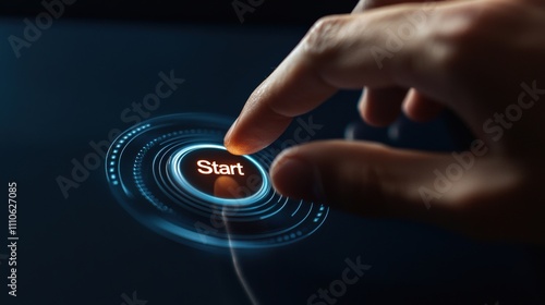 A hand is pressing a start button on a device