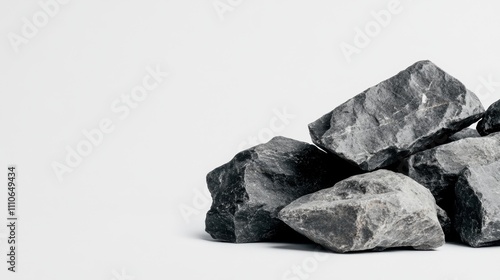 A small pile of irregular rocks shown in profile view, cleanly isolated on a plain white background.