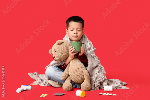 Ill little Asian boy with c...
