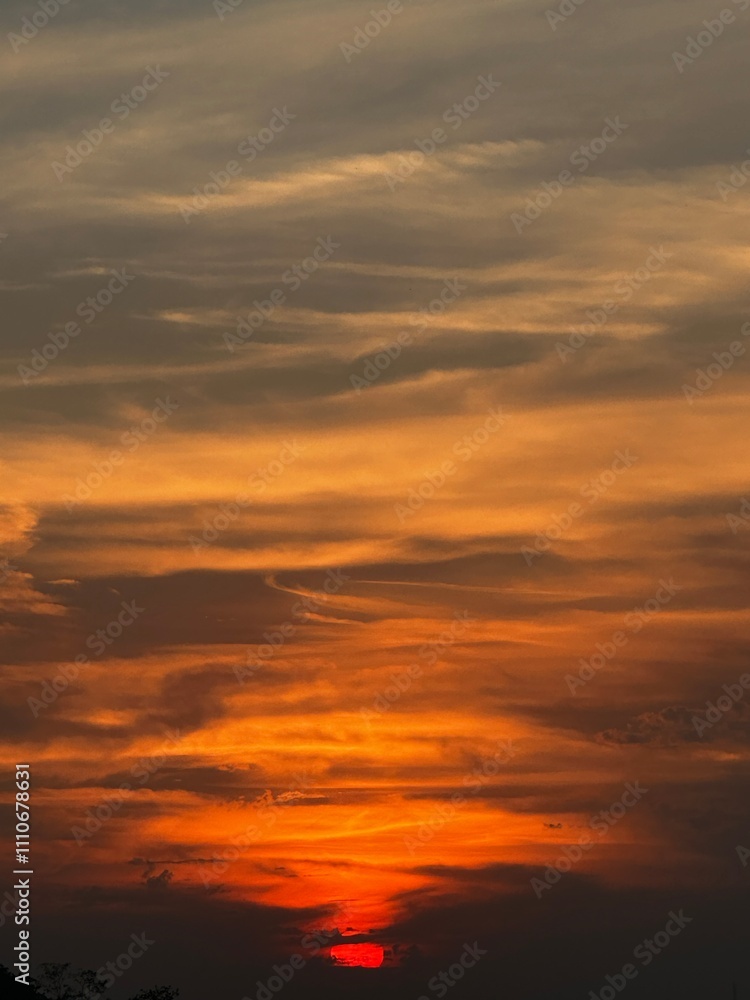 Fiery Sunset over a Silhouetted Landscape Fiery Sunset over a Silhouetted Landscape