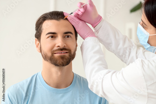 Young man receiving injecti...