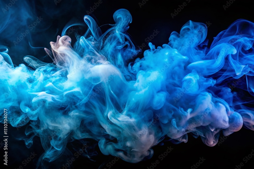 Fototapeta premium Ethereal Aerial Photography of Abstract Blue Smoke Swirling on Black Background, Capturing the Mystical Movement of Smoke Rolling Low Across the Ground