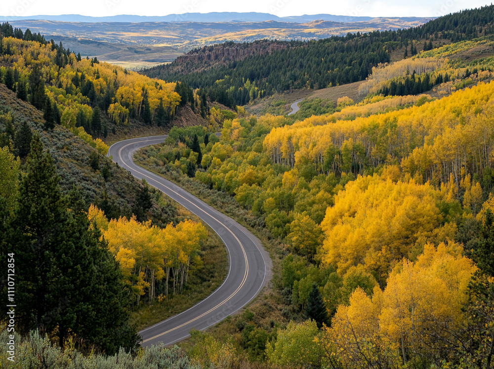 Winding road through vibrant autumn foliage in a mountainous landscape during the day Winding road through vibrant autumn foliage in a mountainous landscape during the day