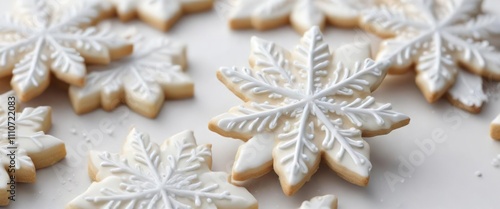 Delicate snowflake sugar cookies on a white background , festive baking, baked goods, sweet treats