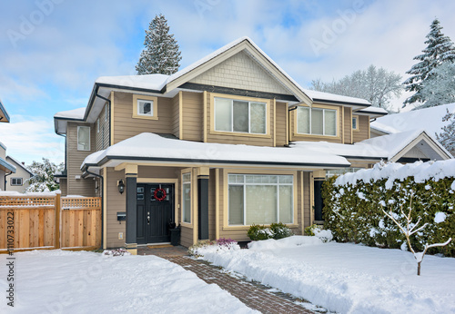 A perfect neighborhood. Entrance of nice residential house in snow
