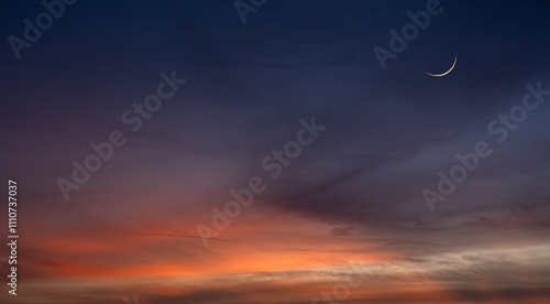 Dusk sky, Crescent moon on twilight dark blue hour sky background, Religion of Islamic well space for text Ramadan Kareem, Eid Al Fitr, Eid Al Adha, Eid Mubarak  