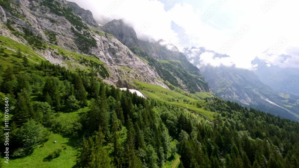 fpv flying over the Swiss alps in Switzerland Grindelwald beautiful views of green mountain landscape fpv flying over the Swiss alps in Switzerland Grindelwald beautiful views of green mountain landscape