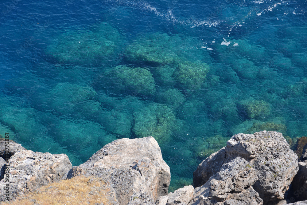 a rocky cliff with clear water and low waves top view wallpaper a rocky cliff with clear water and low waves top view wallpaper