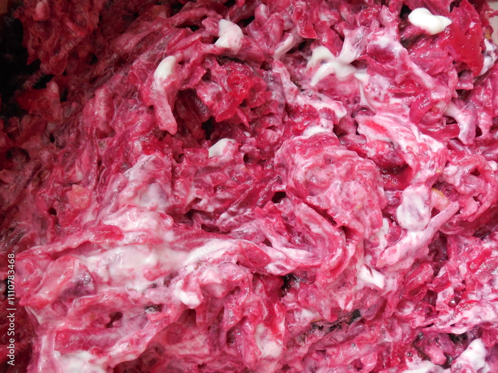 Obraz premium A dish with mayonnaise and beetroot, cooking.beautiful bright background.