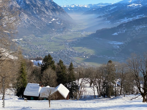 Winter atmosphere in spacious subalpine valley Seeztal along the Seez River between Lake Walensee and the Rheintal Valley, Walenstadtberg - Canton of St. Gallen, Switzerland (Schweiz) photo