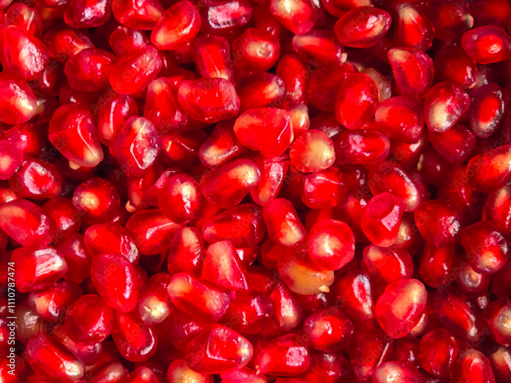 pomegranate grains scattered on the table top view close-up pomegranate grains scattered on the table top view close-up
