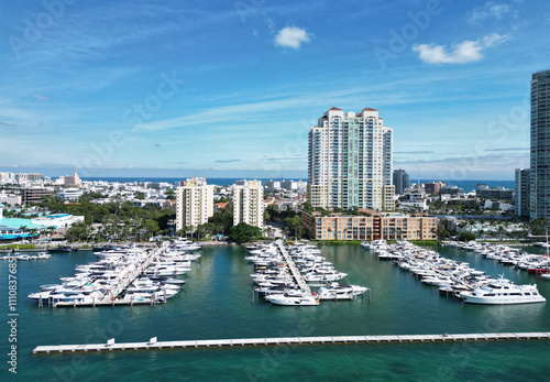 Luxury South beach marina. Luxury yacht. Miami south beach view. Yacht club. Marina in Miami, Florida. Biscayne bay. Downtown Miami marina with luxury yacht. Summer vacation. Sleek boats