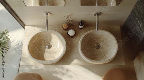 A chic beige bathroom captured from above, showcasing a stone double sink, a luxurious bathtub, and a mixer faucet for a contemporary, sleek look photo