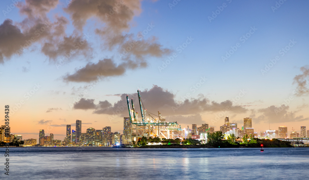 Fototapeta premium Cityscape landscape. Florida panorama. Skyscraper architecture of Miami. Miami South beach landscape at night. Aerial Miami skyscraper. Miami beach and cityscape. Luxurious lifestyle. Sunset sky