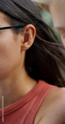 Wallpaper Mural Two young women are using a laptop while sitting on the building steps. They are talking and smiling. Close-up of their faces. Torontodigital.ca