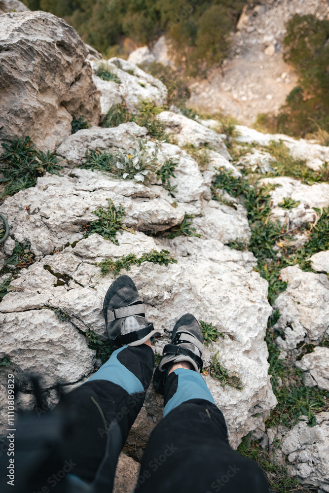 hiker in the mountains, top down view from rock climbing wall hiker in the mountains, top down view from rock climbing wall