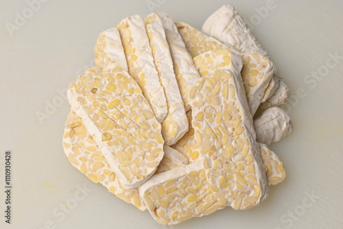 Stack the tempeh slices. Traditional food from fermented soybeans becomes tempeh.