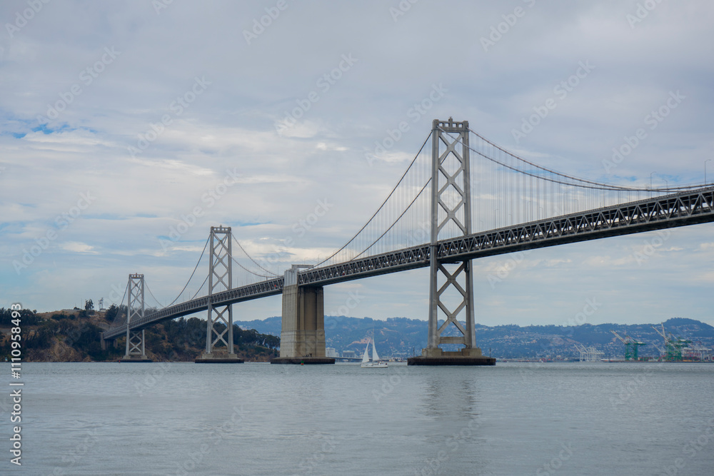 Naklejka premium San Francisco Oakland Bay Bridge, California, United States on a cloudy day.