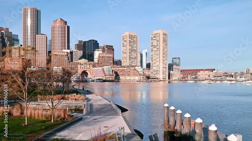 A timelapse of the iconic city of Boston in Massachusetts, USA showcasing the Fan Pier at Seaport Boulevard with the skyscrapers of the Financial District at the background. photo