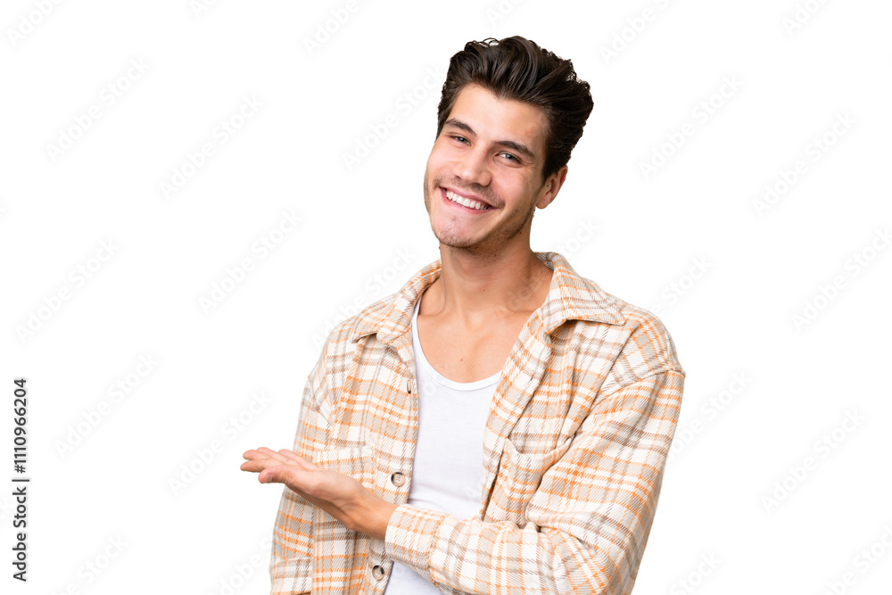 Young handsome caucasian man over isolated background presenting an idea while looking smiling towards Young handsome caucasian man over isolated background presenting an idea while looking smiling towards