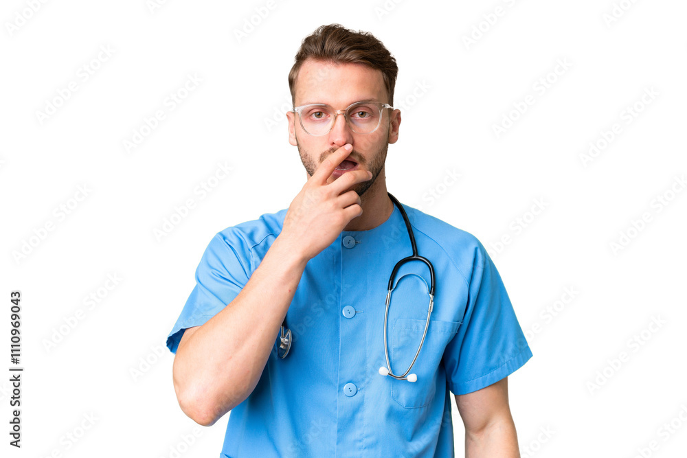 Young nurse man over isolated chroma key background surprised and shocked while looking right Young nurse man over isolated chroma key background surprised and shocked while looking right