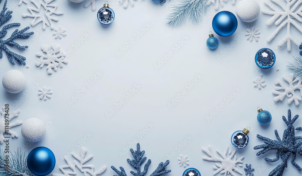 Fototapeta premium A blue and white Christmas background with snowflakes, blue ornaments and decorations on the ground.