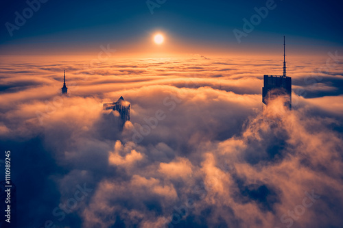 Obraz na płótnie Beautiful panoramic fabulous, mesmerizing, unreal, aerial drone view of skyscrapers sticking out of low fog at sunrise, Warsaw, Poland, EU. VARSO - the tallest skyscraper in EU. w salonie