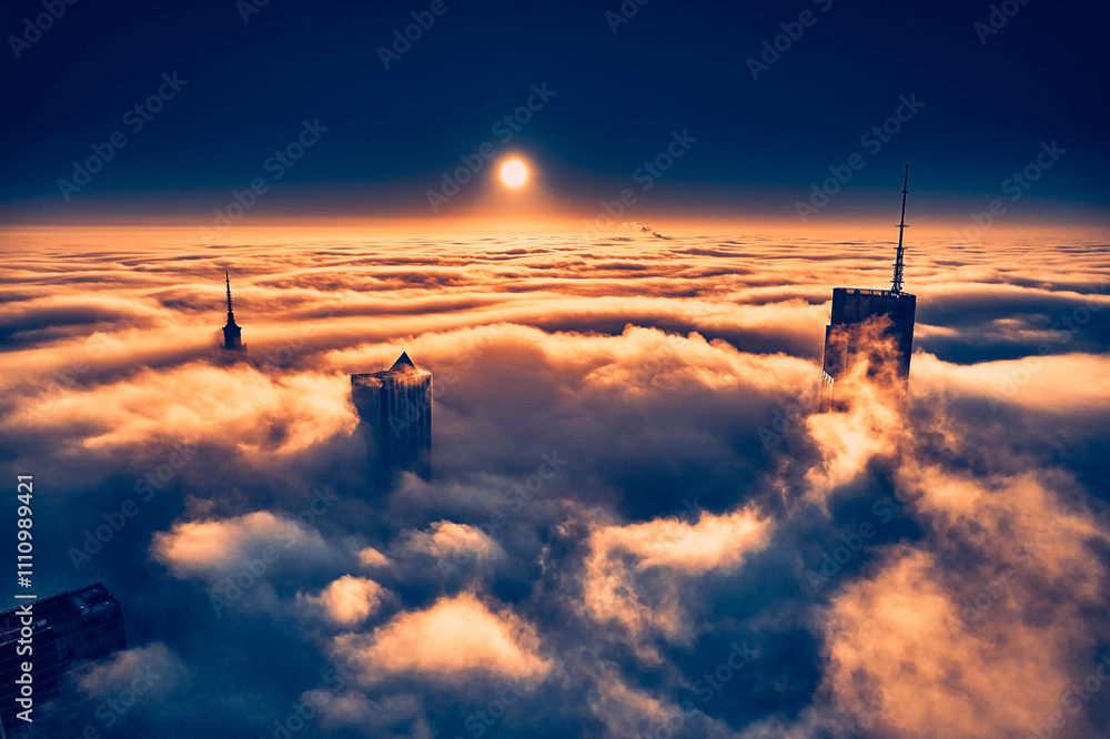 Beautiful panoramic fabulous, mesmerizing, unreal, aerial drone view of skyscrapers sticking out of low fog at sunrise, Warsaw, Poland, EU. VARSO - the tallest skyscraper in EU.