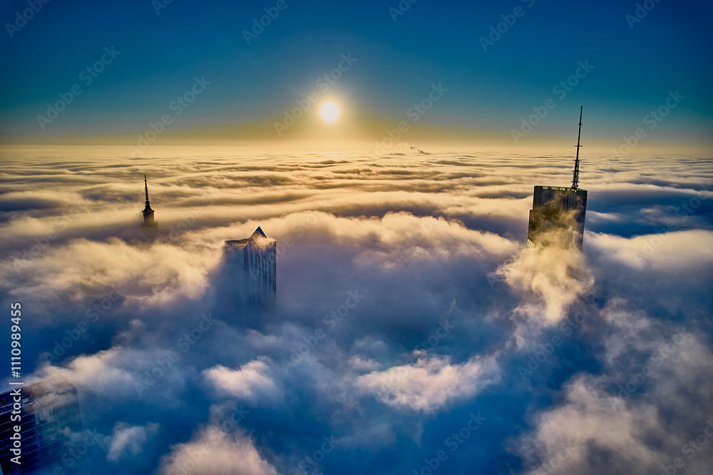 Beautiful panoramic fabulous, mesmerizing, unreal, aerial drone view of skyscrapers sticking out of low fog at sunrise, Warsaw, Poland, EU. VARSO - the tallest skyscraper in EU.